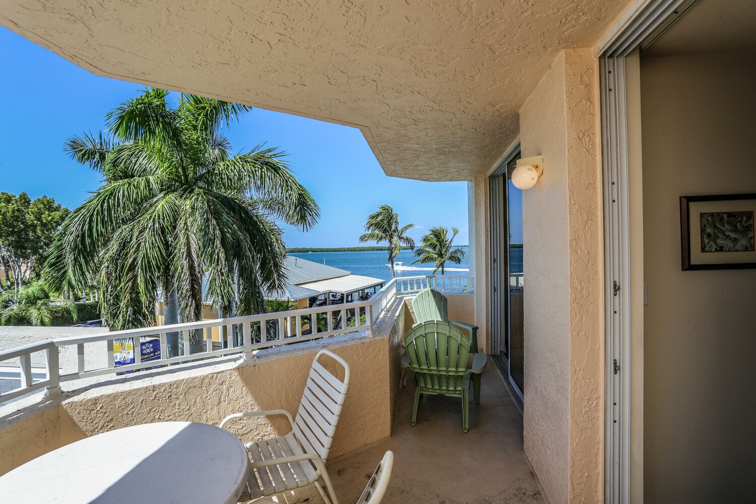 Water views abound in this coastal condo + resort amenities