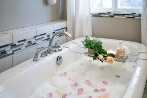 Combined shower/tub, hair dryer, towels, soap