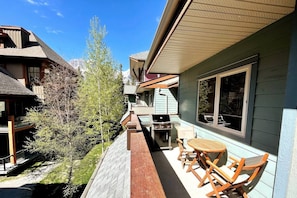 Enjoy al fresco dining on the patio with a barbecue grill and seating for two.