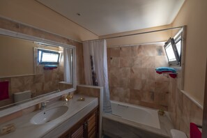 Combined shower/tub, hair dryer, towels, soap