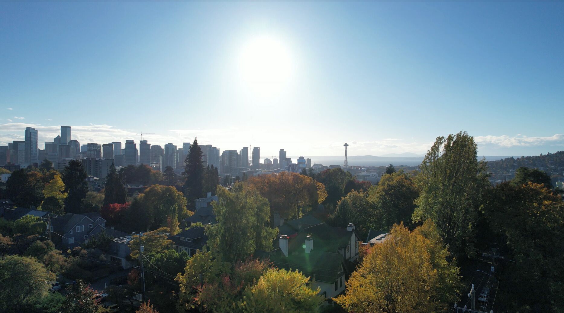 A city skyline with high-rise buildings, a prominent tower, and a mix of residential and commercial areas.