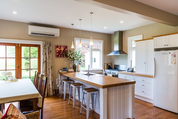 Kitchen / dining area showing fridge. Freezer is to the right in the entryway