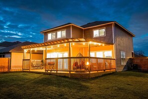 A two-story house with a covered patio area, a fenced backyard, and a garage. - Cozy 3BR Retreat w/Amazing Outdoor Deck Near Randolph AFB & JBSA Ft. Sam Houston (Converse)