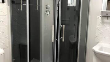 Shower, hair dryer, towels, soap