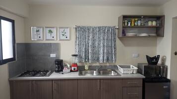 Fridge, stovetop, cookware/dishes/utensils, dining tables