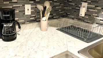 Microwave, coffee/tea maker, toaster, cookware/dishes/utensils