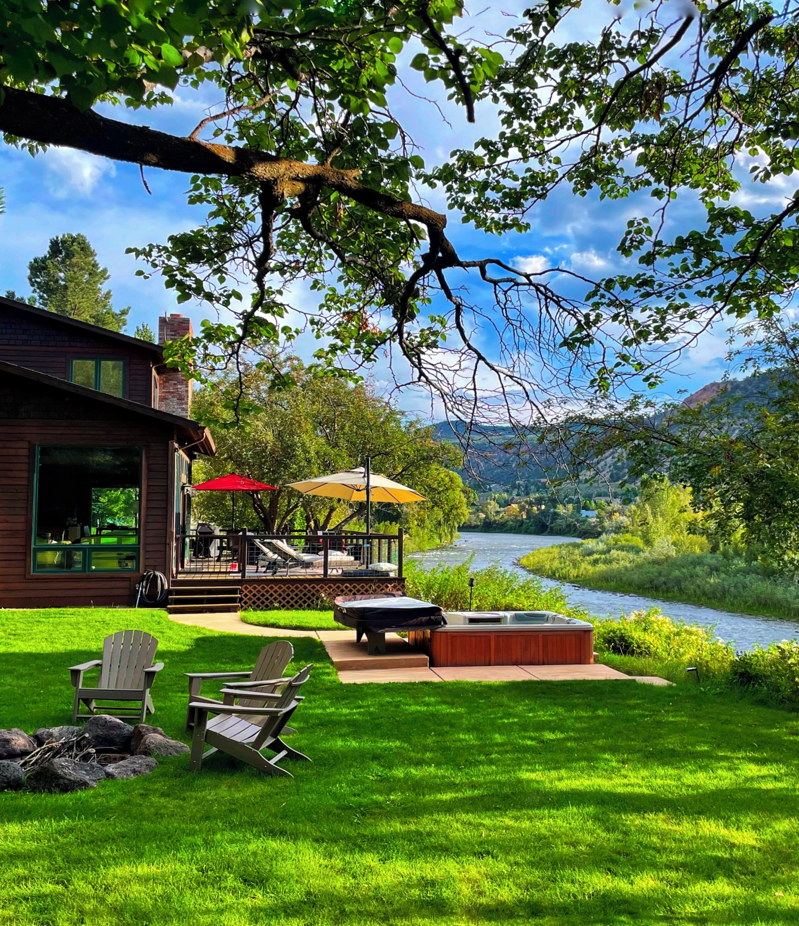 This home boasts front-row river views and direct access to Roaring Fork River.