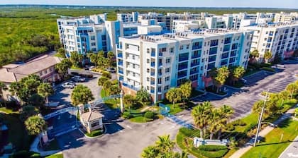 Unit in coveted Oceanwalk complex steps from the ocean with partial ocean views