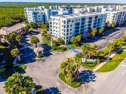 Unit in coveted Oceanwalk complex steps from the ocean with partial ocean views