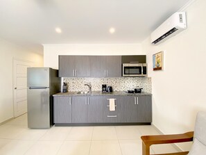 Fridge, microwave, stovetop, coffee/tea maker