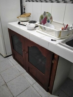 Fridge, microwave, stovetop, coffee/tea maker