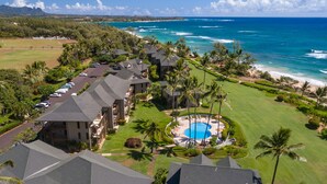 A resort with multiple buildings, a swimming pool, and a view of the ocean. - BEST Ocean View in the Resort...Stunning & Panoramic!  Completely Renovated 2BR (Lihue)