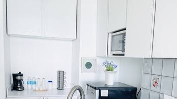 Microwave, coffee/tea maker, cookware/dishes/utensils