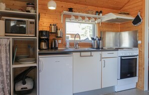 Fridge, stovetop, coffee/tea maker, cookware/dishes/utensils