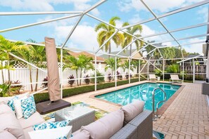 Outdoor pool, a heated pool - New On The Market! Newly Renovated 3BR/2BA Heated Pool & Screen Enclosure. (Jupiter)
