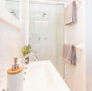 Bathtub, hair dryer, soap, toilet paper - Coastal Sanctuary (The Junction)