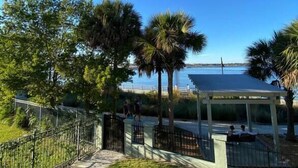 A pathway leading to a gazebo with a view of a body of water. - Exceptional Condo on the Bradenton Riverwalk (Bradenton)