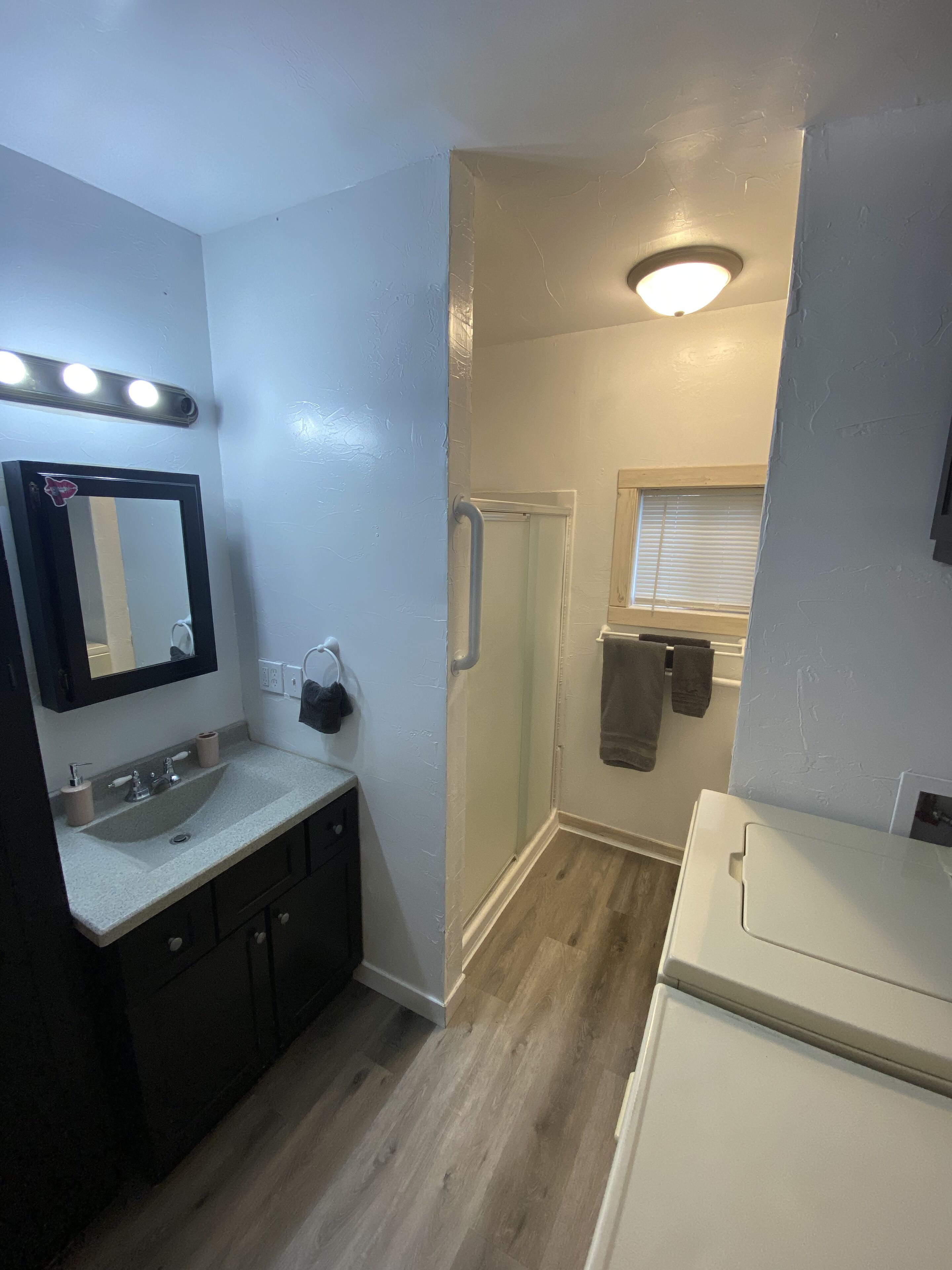 Shower, towels, soap, toilet paper