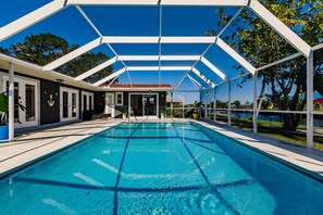 Outdoor pool, a heated pool - WATERFRONT MODERN 4/2 FLORIDA HOME POOL BOAT DOCK AND LIFT DIRECT GULF ACCESS (Port Charlotte)