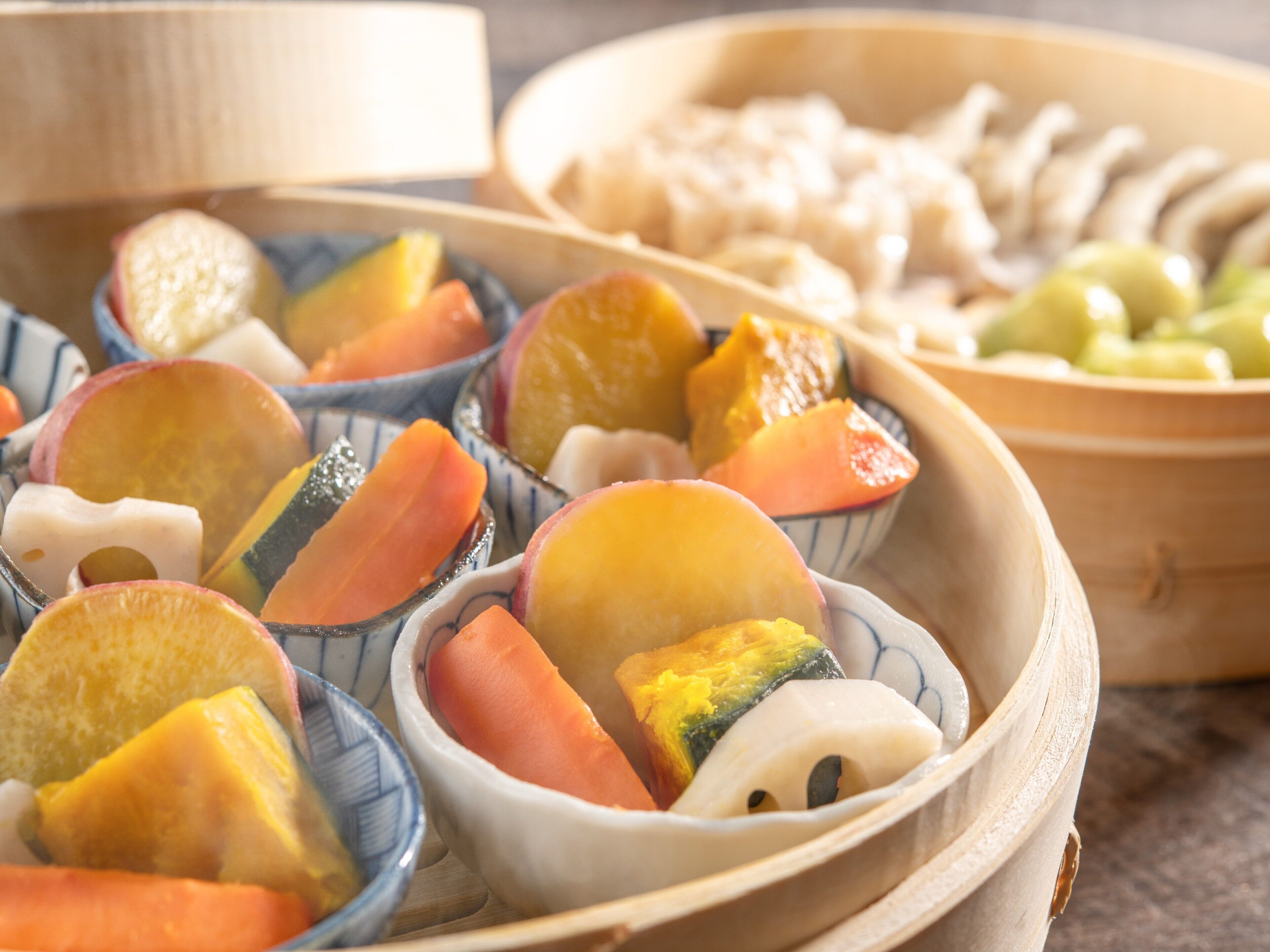 A wooden tray with various fruits and vegetables.