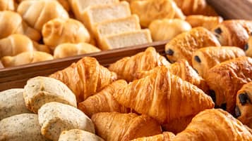 A variety of baked goods including bread and croissants.