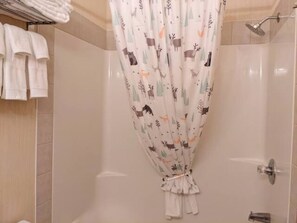 Combined shower/tub, hair dryer, towels, soap
