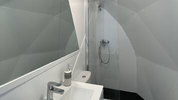 Shower, towels, soap, toilet paper