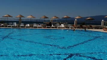 Seasonal outdoor pool, open 8:00 AM to 6:00 PM, pool umbrellas