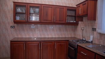 Fridge, microwave, spices, dining tables