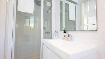 Shower, eco-friendly toiletries, hair dryer, towels