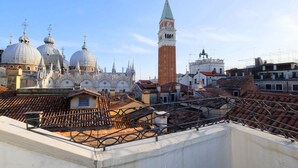 A view of Venice's historic architecture, including domes and a tall tower. - Hotel ai do Mori (Venice)