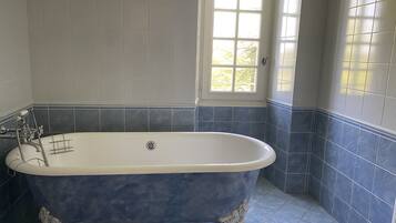 Combined shower/tub, hair dryer, towels, soap