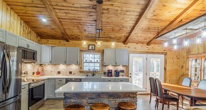 New 3 Bedroom Log Cabin nestled in the woods with one acre fishing lake .