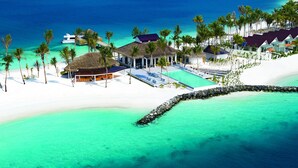 A tropical resort with overwater bungalows, a swimming pool, and a beach. - OBLU SELECT Lobigili  with Free Transfers (Lobigili)