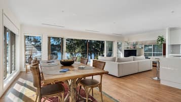 Enjoy meals in the spacious dining area with a large table and comfortable chairs.