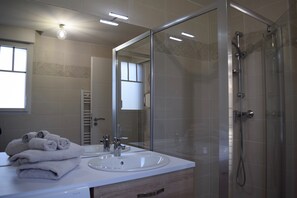 Shower, hair dryer, towels, soap