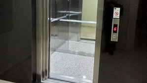 An elevator with a digital display, metallic interior, and a sign on the wall. - KURT OTEL (Trabzon)