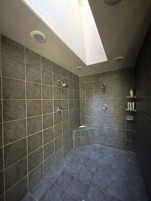 Combined shower/tub, hair dryer, towels, soap