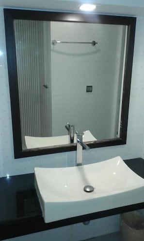 Shower, free toiletries, slippers, towels