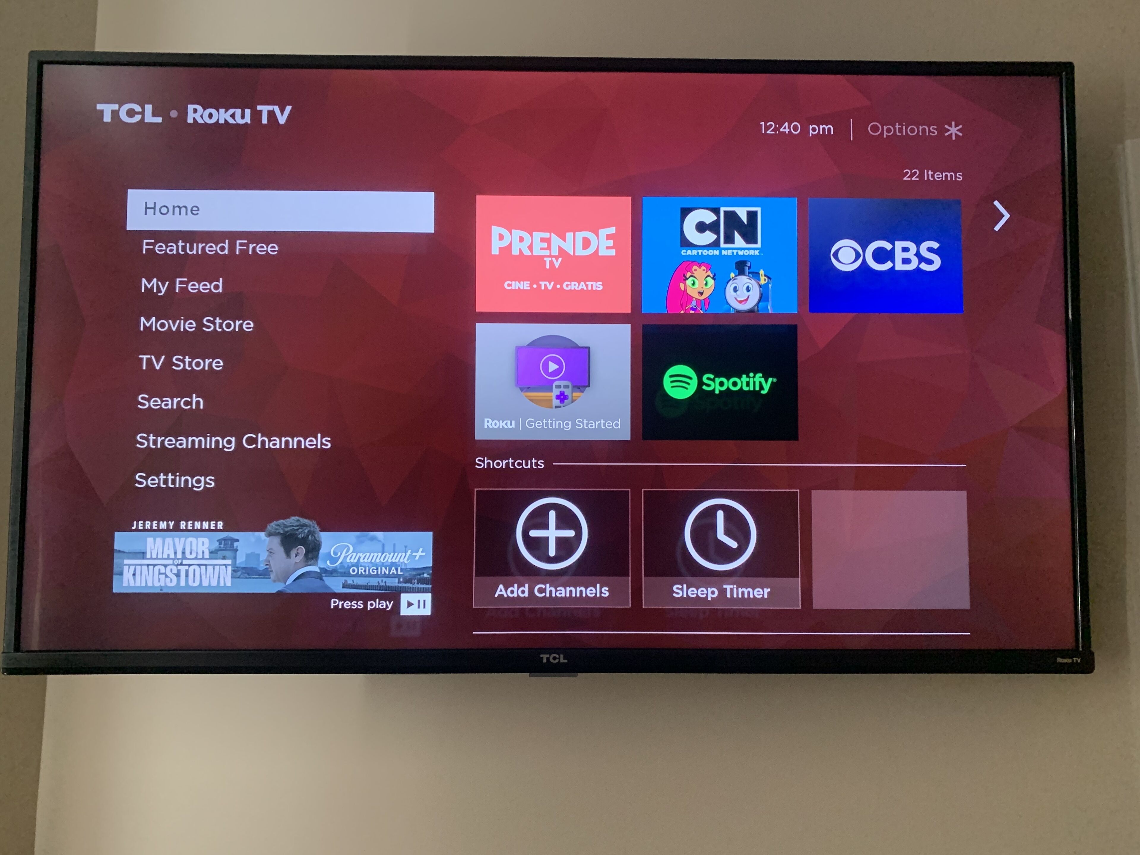 A TCL Roku TV interface with various streaming options and settings.