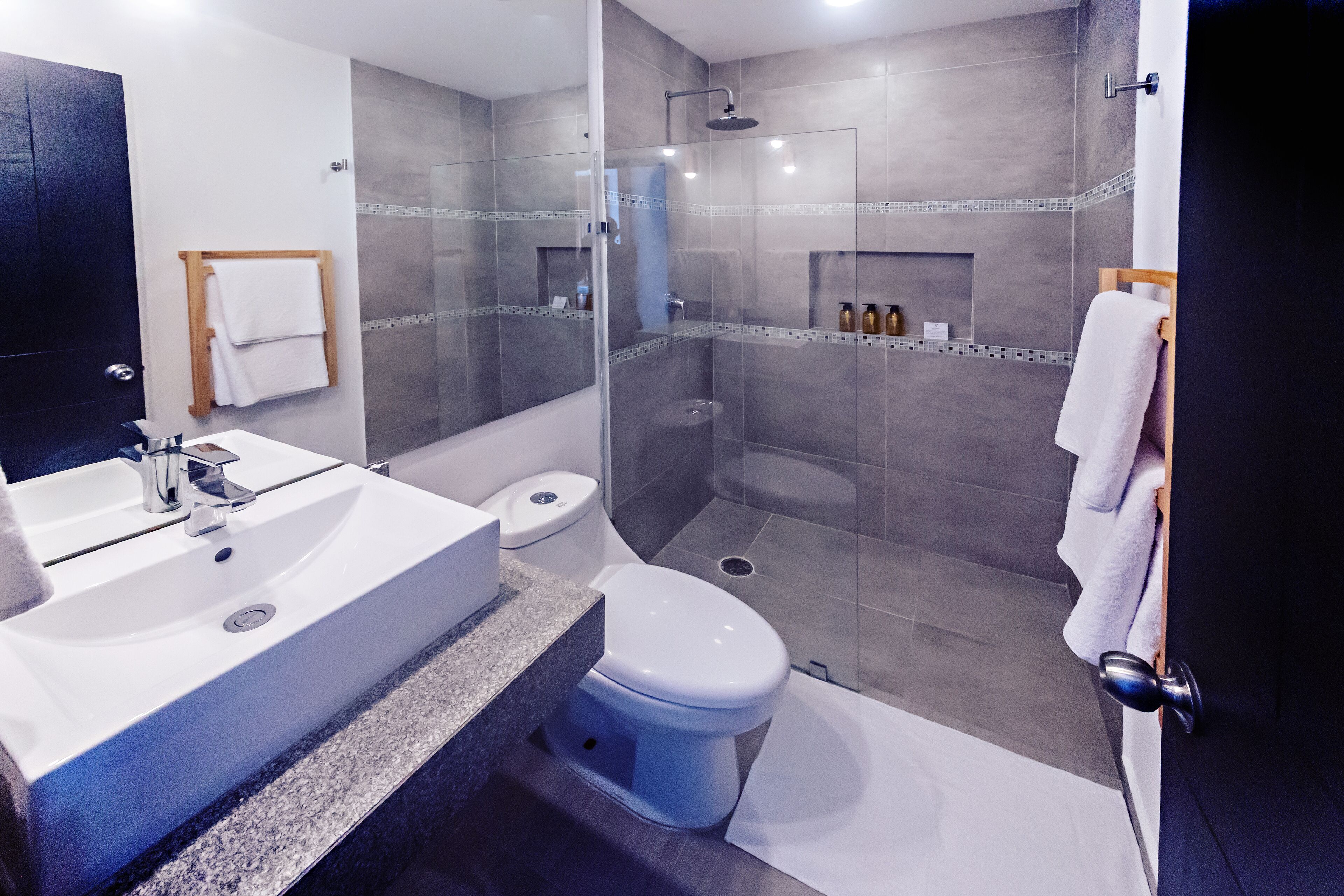 shower, rainfall showerhead, hair dryer, towels