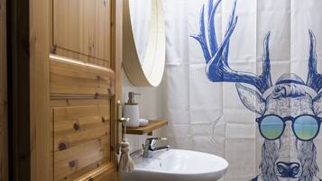 Combined shower/tub, hair dryer, towels, soap