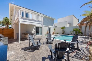 A modern house with a pool, outdoor seating, and a covered patio area. - Two Minute Walk to Beach (South Padre Island)