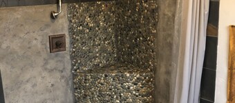 The Loft King Room w/ full kitchen in historic Carriage House building.