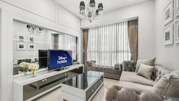 Apartment, 3 Bedrooms, City View | Living area | 43-inch Smart TV with cable channels, TV, Netflix