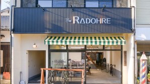 A two-story building with a storefront labeled "RADOHRE".