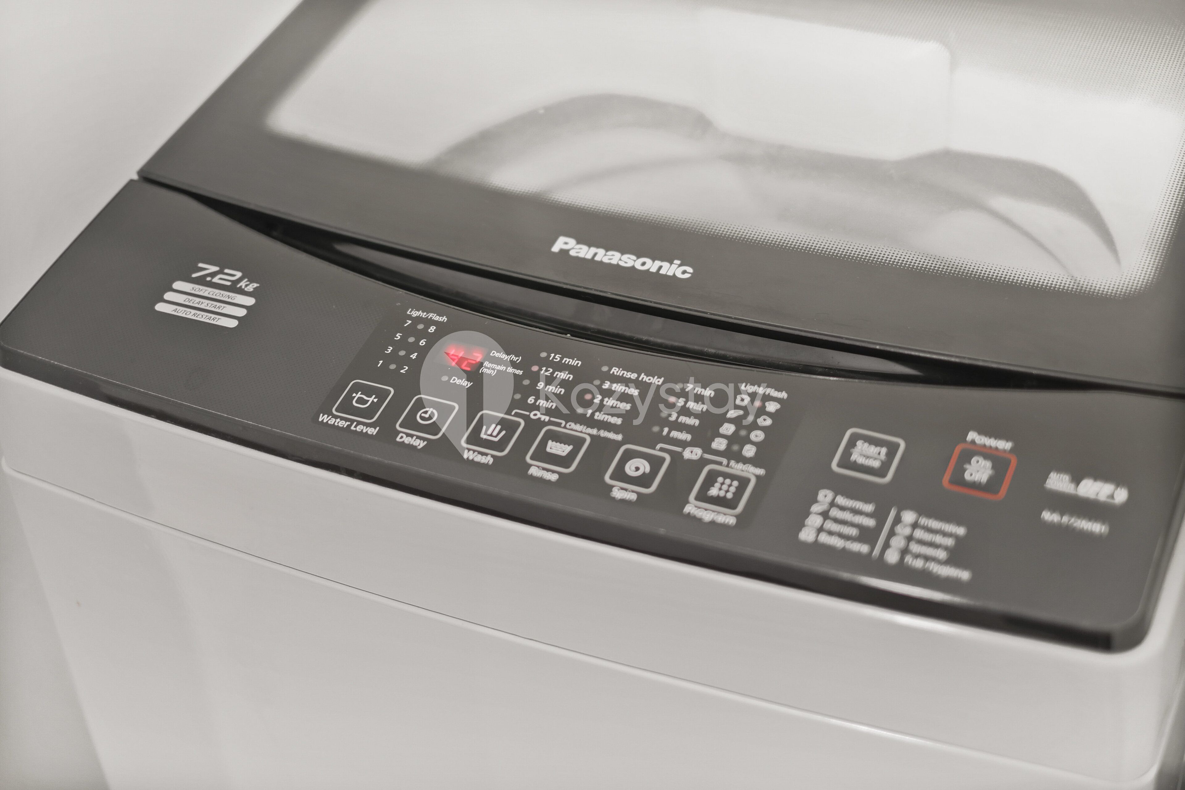 A Panasonic appliance with a control panel featuring multiple buttons and settings.