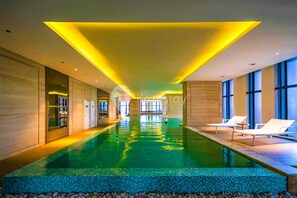 Indoor pool, outdoor pool, pool umbrellas - URBAN by Kozystay (Jakarta)