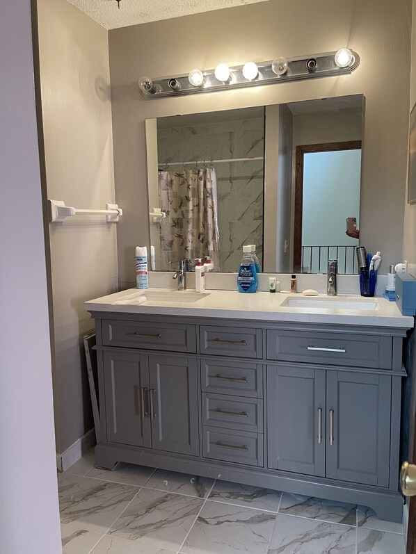 Combined shower/bathtub, bidet, soap, toilet paper