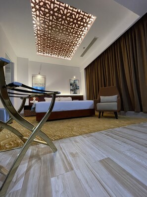 Presidential Suite | Living area | 43-inch flat-screen TV with satellite channels, fireplace, heated floors - Empyrean Hotel (Dhaka)